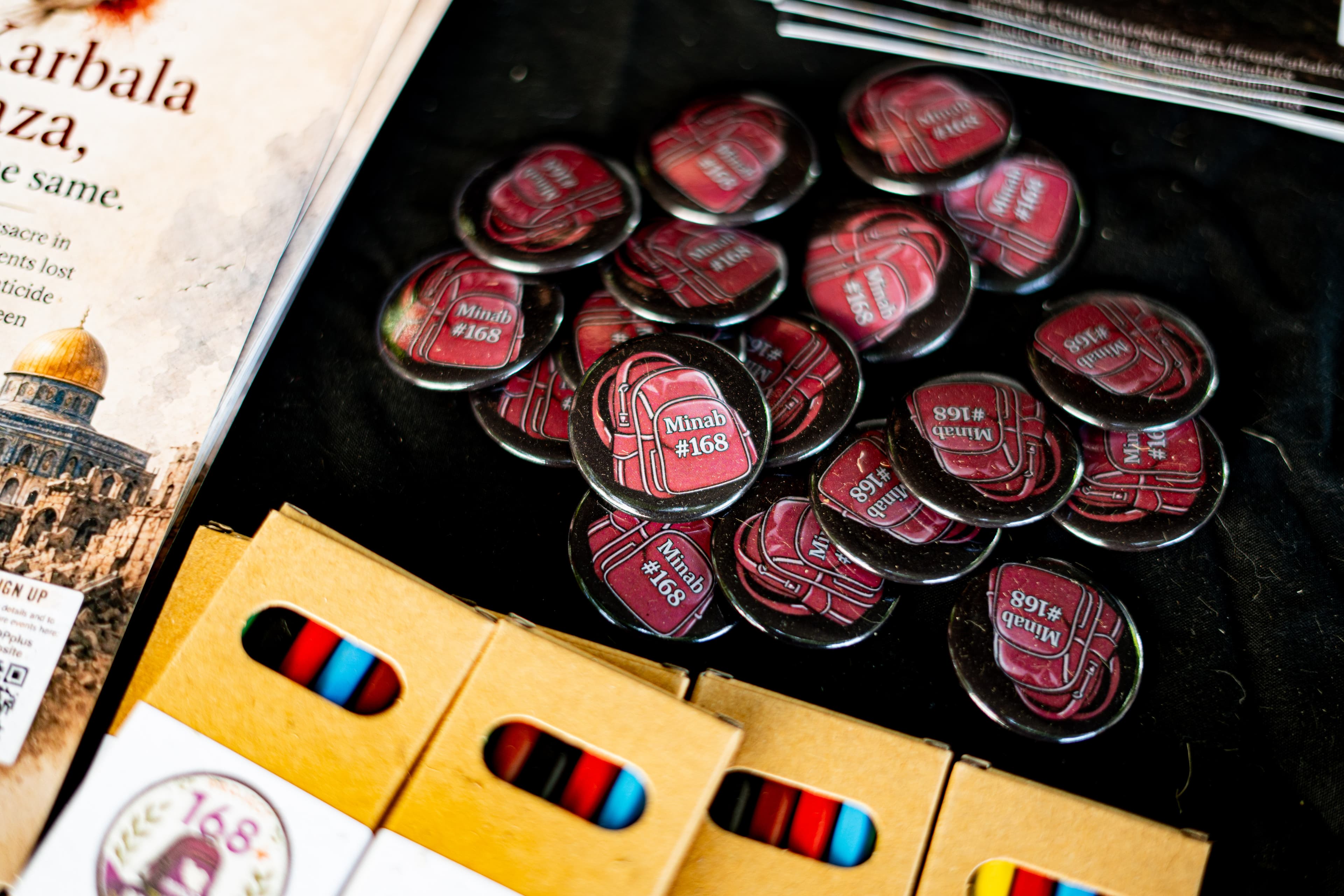 Minab 168 campaign badges and creative materials.