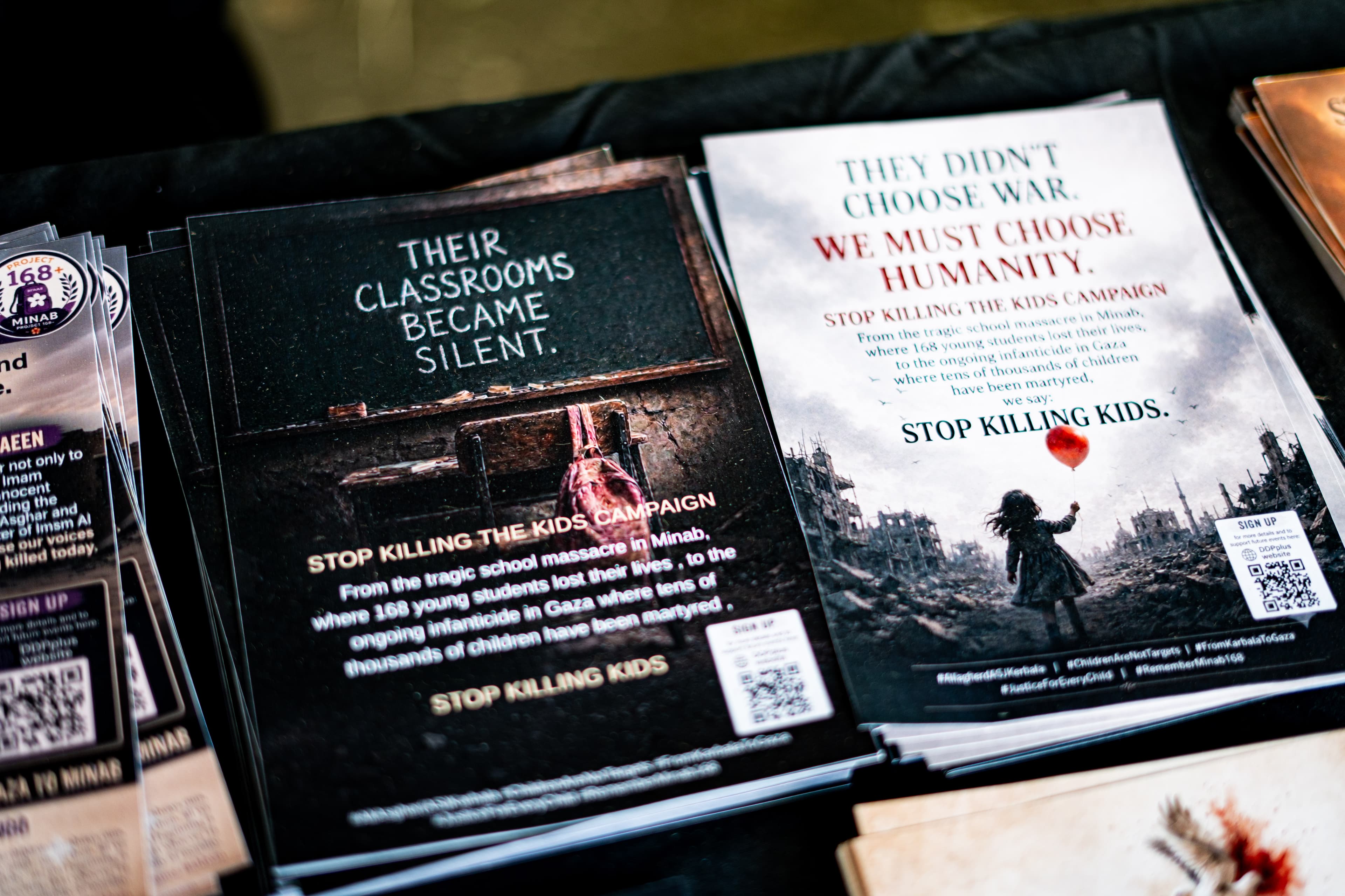 Campaign posters calling for humanity and an end to killing children.